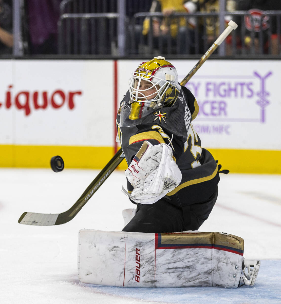 Golden Knights goaltender Laurent Brossoit (39) stops a shot from the Columbus Blue Jackets dur ...