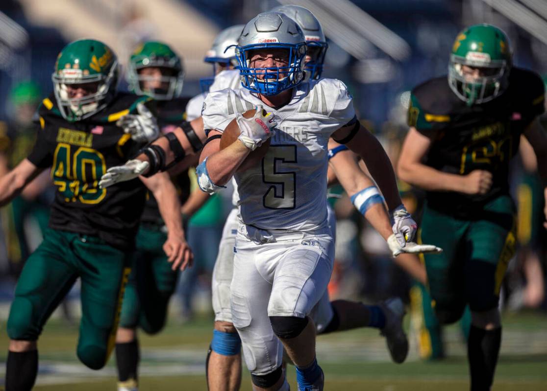 Pahranagat Valley’s Jaren Leavitt (5) breaks off a first half touchdown run past Eureka& ...