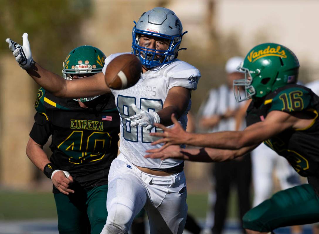 Pahranagat Valley’s Kobi Fiatoa (80) fights for a reception with Eureka’s Clayton ...