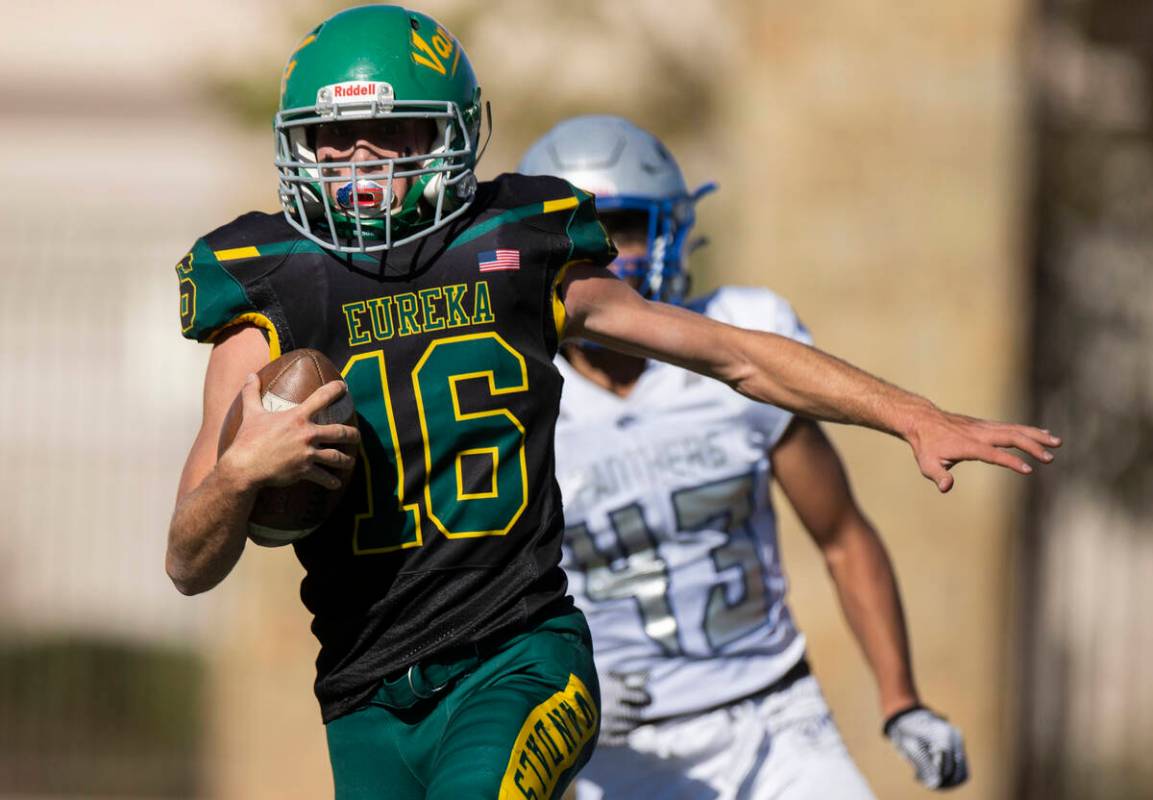 Eureka’s Clayton Shoda (16) breaks off a big run past Pahranagat Valley’s Jordan ...