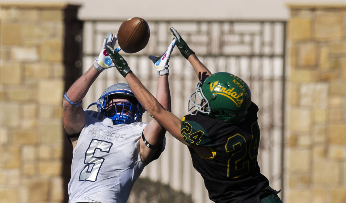 Pahranagat Valley’s Jaren Leavitt (5) makes a leaping catch over Eureka’s Antho ...