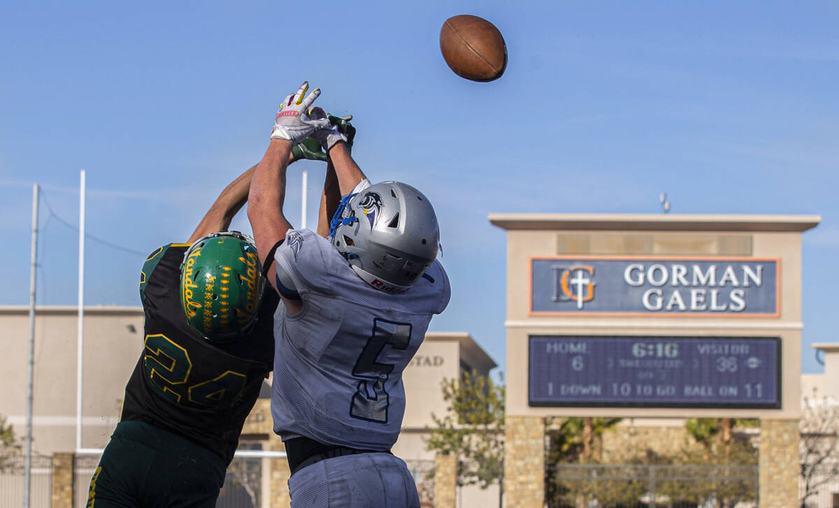 Pahranagat Valley’s Jaren Leavitt (5) fights for a reception with Eureka’s Anthon ...