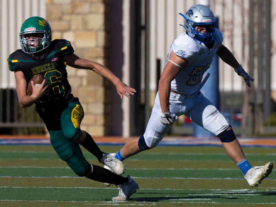 Eureka’s Clayton Shoda (16) breaks off a big run past Pahranagat Valley’s Jacob G ...