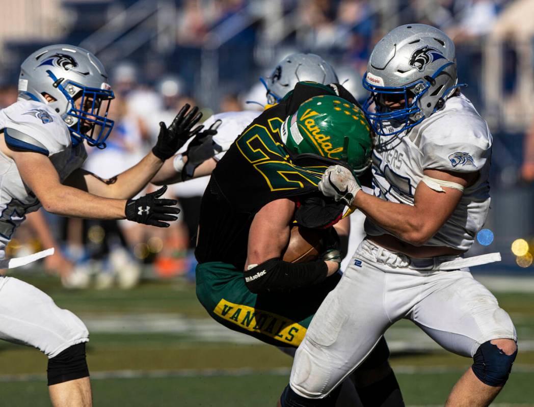 Pahranagat Valley’s Jacob Griffin (55) tackles Eureka’s Danny Lee (22) for a loss ...