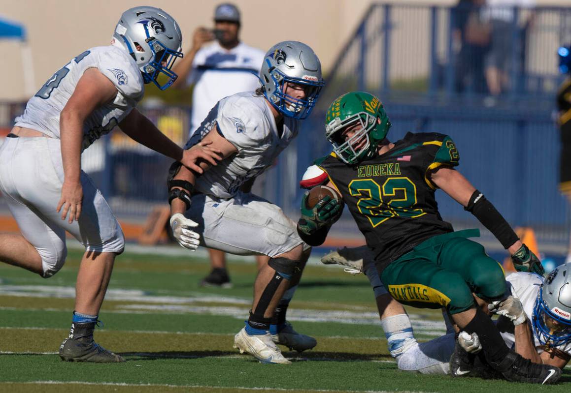 Eureka’s Danny Lee (22) is gang tackled by Pahranagat Valley defenders in the second hal ...