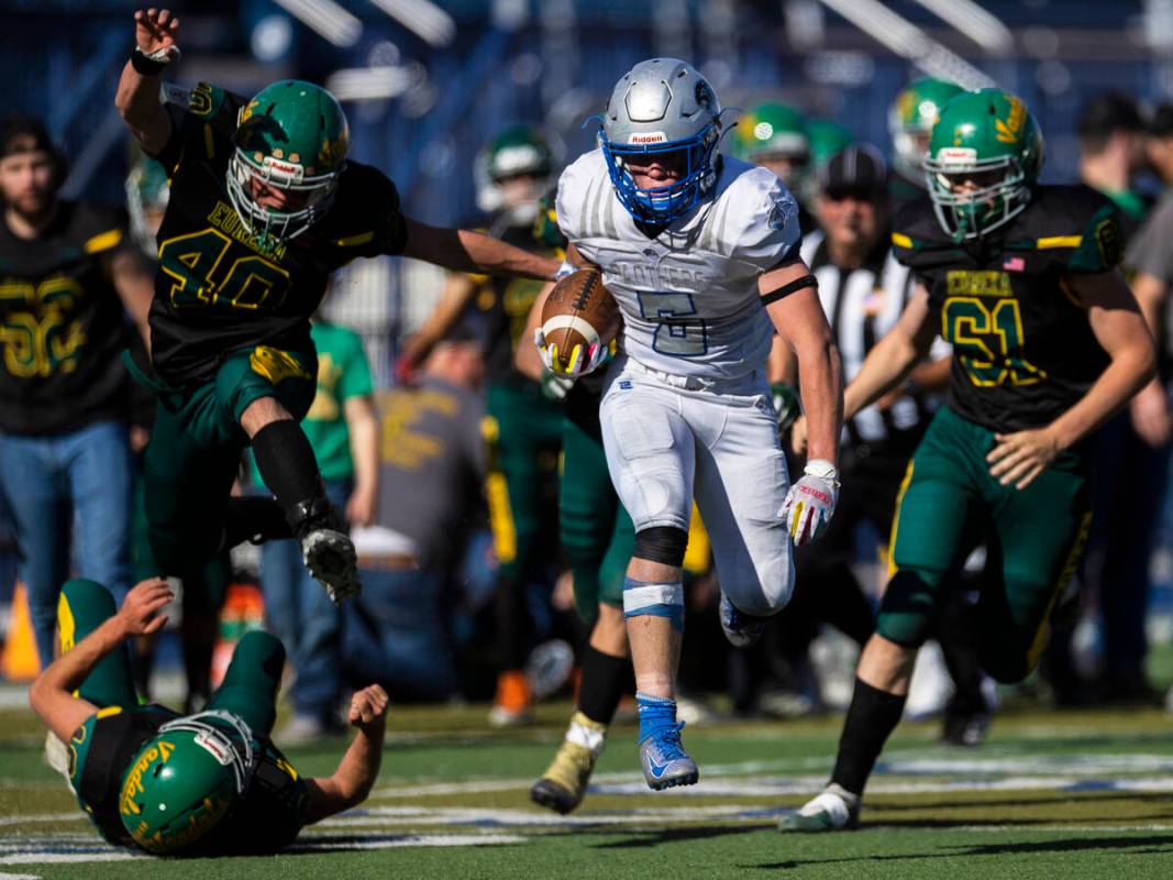 Pahranagat Valley’s Jaren Leavitt (5) breaks off a first half touchdown run past Eureka& ...