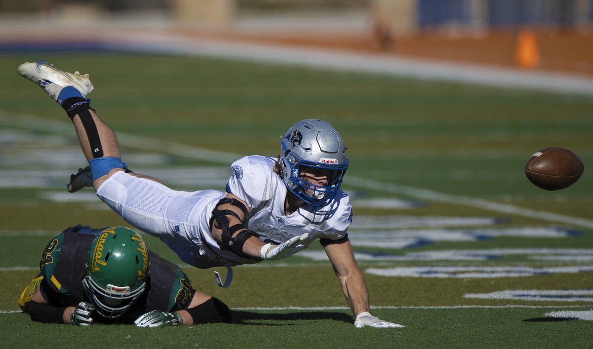 Pahranagat Valley’s Paul Lewis (19) dives for a pass with Eureka’s Tristan Auch ...