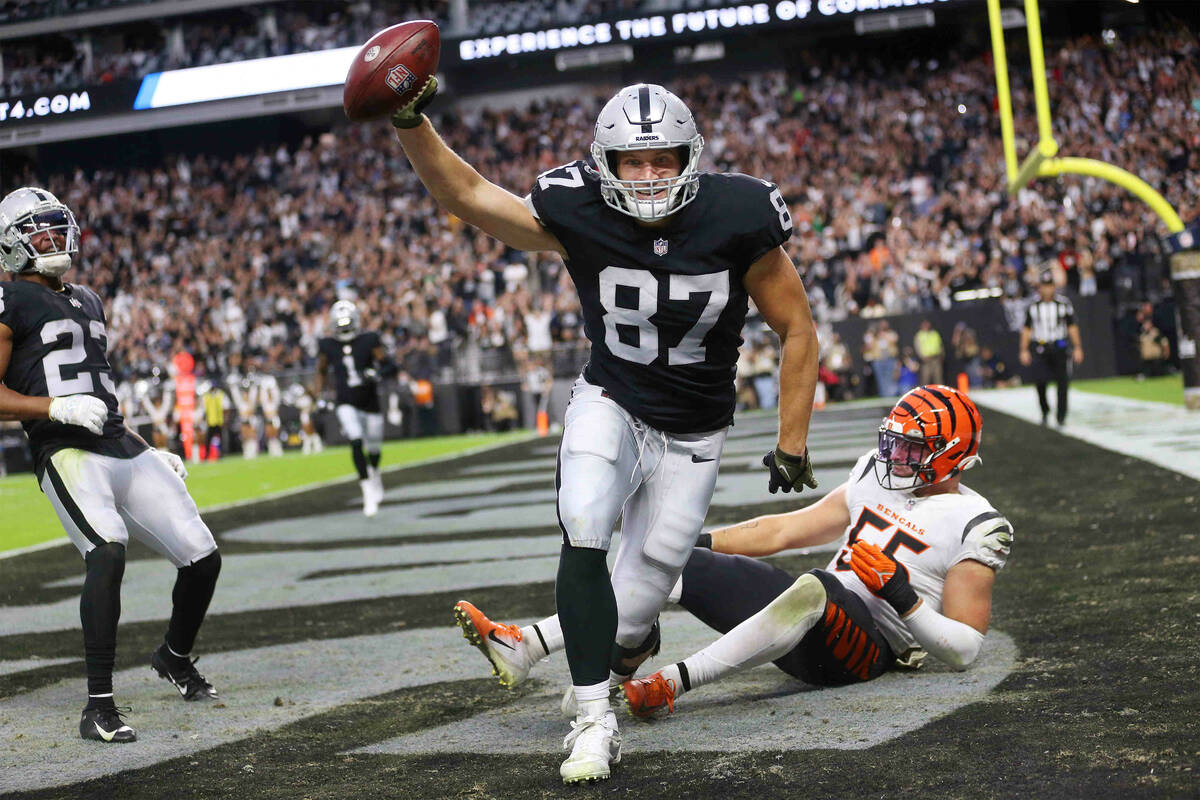 Las Vegas Raiders tight end Foster Moreau (87) makes a touchdown catch under pressure from Cinc ...