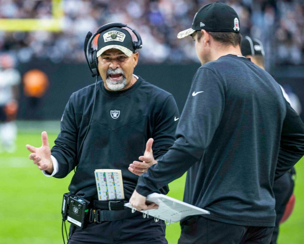 Raiders interim head coach Rich Bisaccia yells at an assistant on the sidelines versus the Cinc ...