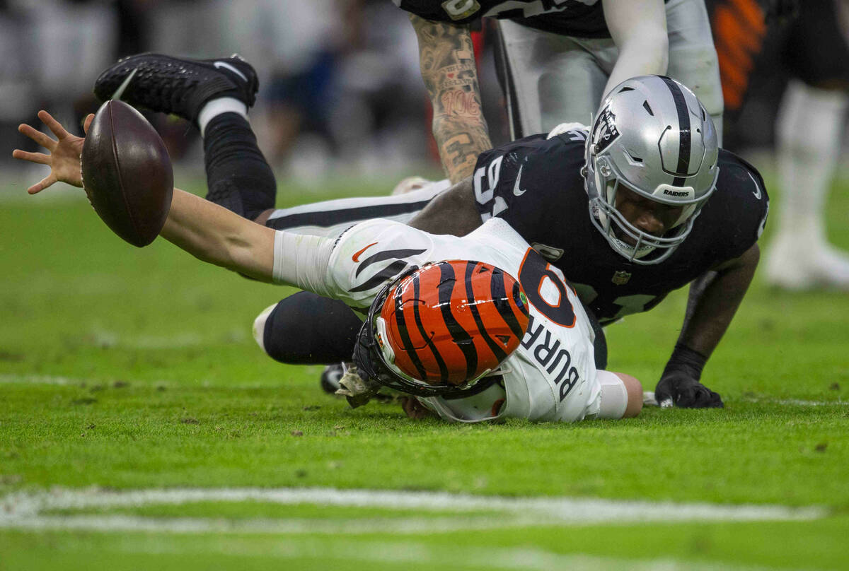 Raiders defensive end Yannick Ngakoue (91) sacks Cincinnati Bengals quarterback Joe Burrow (9) ...