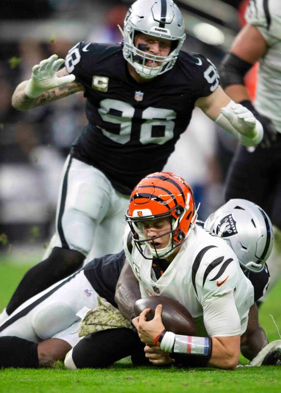 Raiders defensive end Yannick Ngakoue (91) sacks Cincinnati Bengals quarterback Joe Burrow (9) ...
