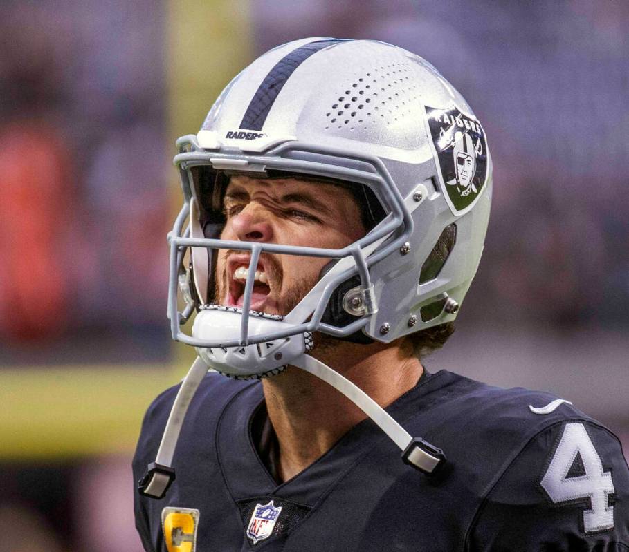 Raiders quarterback Derek Carr (4) yells to teammates as they take the field versus the Cincinn ...