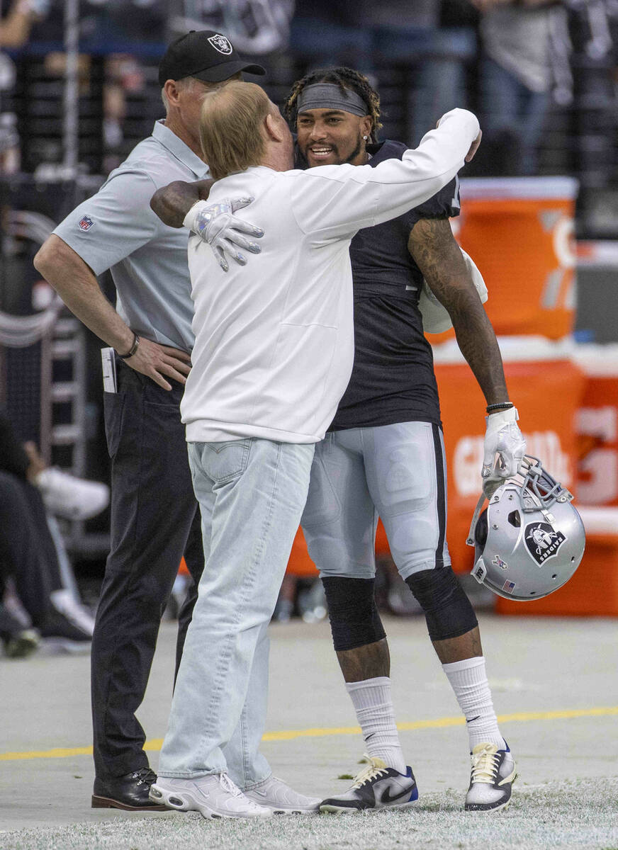 Raiders owner Mark Davis hugs Raiders wide receiver DeSean Jackson (1) as they prepare to face ...