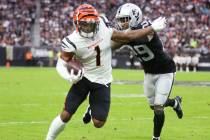 Raiders cornerback Casey Hayward (29) pushes Cincinnati Bengals wide receiver Ja'Marr Chase (1) ...