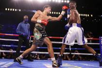 Janibek Alimkhanuly, left, connects a punch against Hassan N’Dam N’Jikam in the f ...
