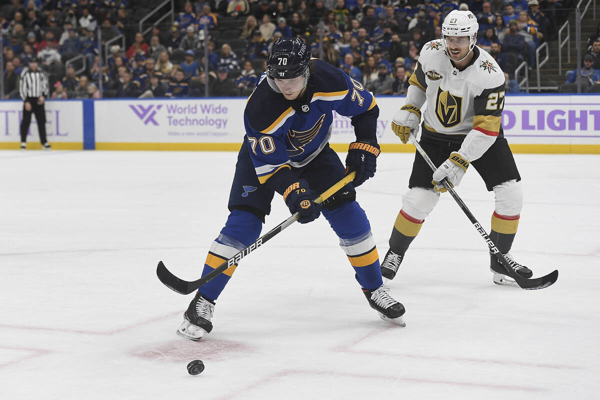 St. Louis Blues' Oskar Sundqvist (70) handles the puck against Vegas Golden Knights' Shea Theod ...