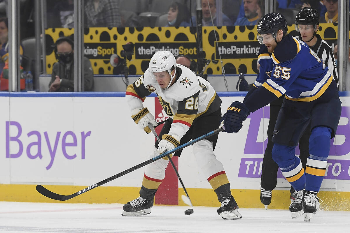 Vegas Golden Knights' Mattias Janmark (26) works against St. Louis Blues' Colton Parayko (55) d ...