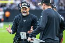 Raiders interim head coach Rich Bisaccia yells at an assistant on the sidelines versus the Cinc ...