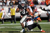 Oakland Raiders running back Josh Jacobs runs with the ball away from Cincinnati Bengals outsid ...