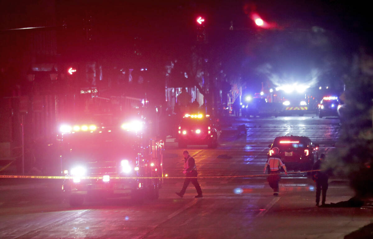 Police investigate at the scene of a crash involving multiple people and injuries at a holiday ...