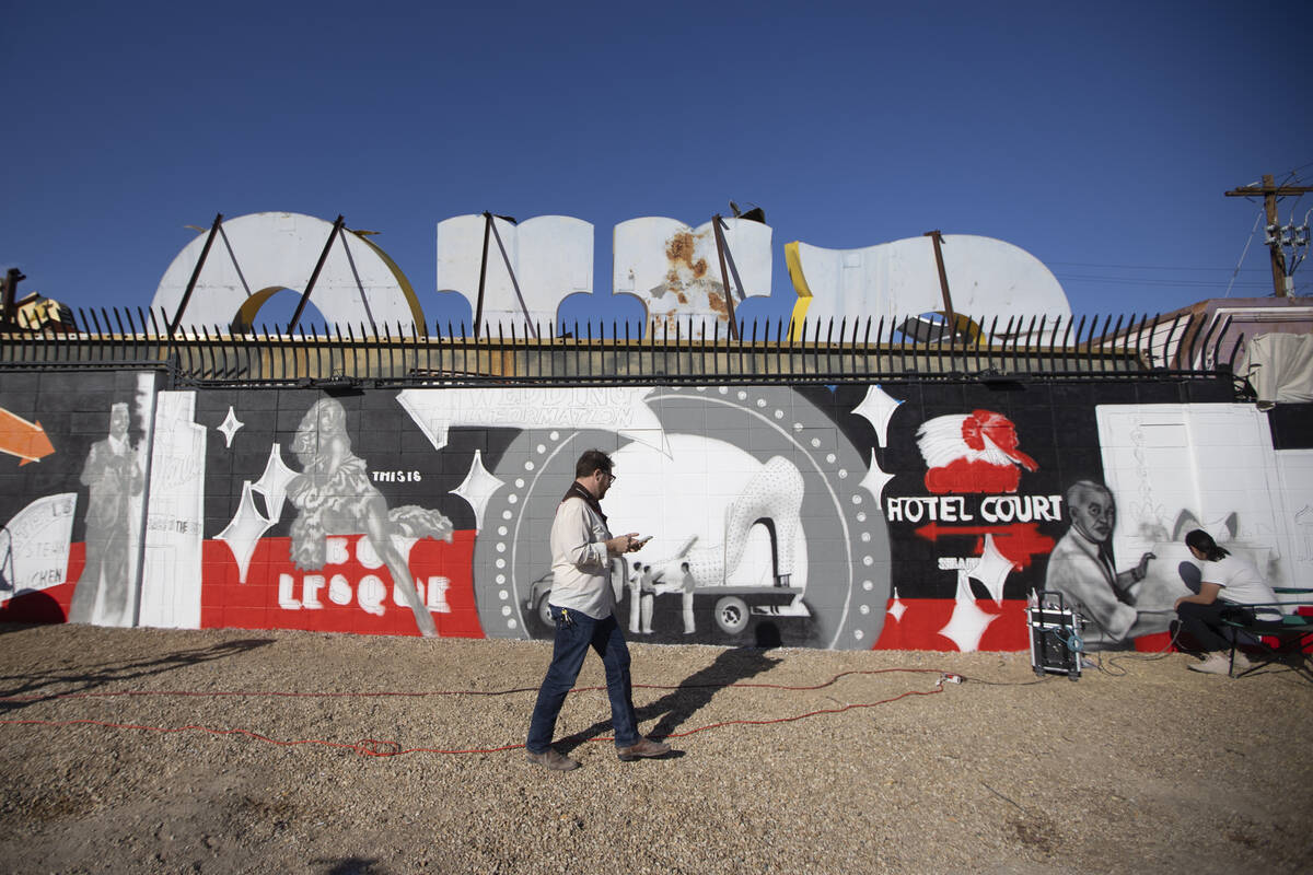 Nanda Sharifpour, right, works on a mural outside of the Neon Museum North Gallery in Las Vegas ...
