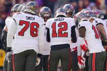 Tampa Bay Buccaneers quarterback Tom Brady (12) huddles with teammates in the first half of an ...