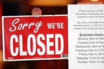 A commercial business is closed in Sydney on Aug. 13, 2021, as greater Sydney continues a weeks ...