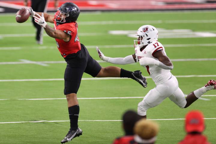 UNLV Rebels tight end Giovanni Fauolo Sr. (45) misses a catch under pressure from Fresno State ...