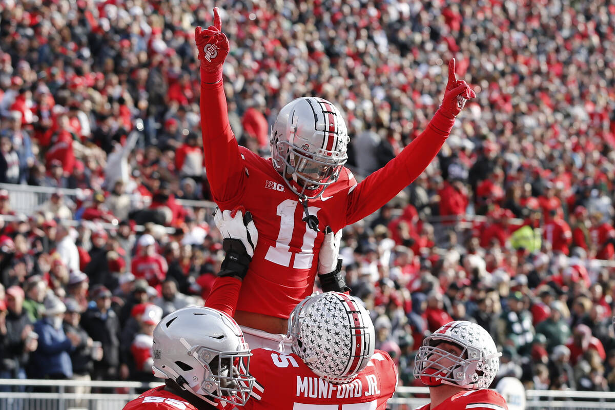 Ohio State receiver Jaxon Smith-Njigba celebrates his touchdown against Michigan State during t ...