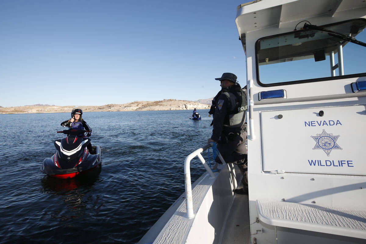 Donnie Beale of Las Vegas, left, chats with Sean Flynn, Nevada Department of Wildlife game ward ...