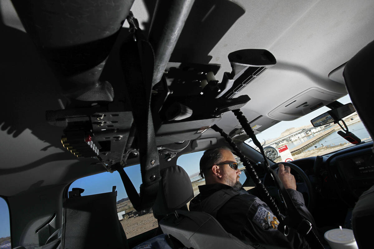 Sean Flynn, Nevada Department of Wildlife game warden, drives a truck to Lake Mead near Boulder ...
