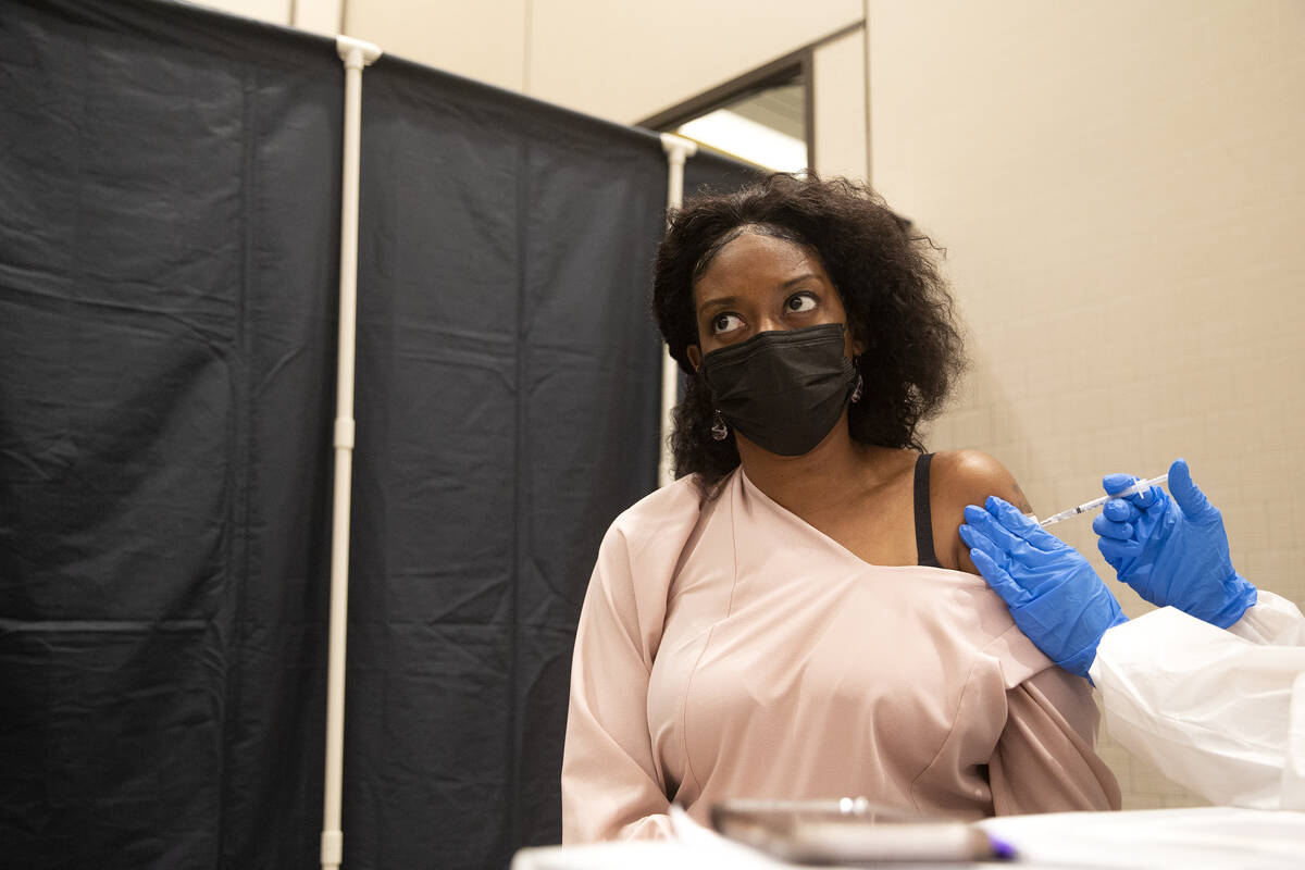 Jessica Dula receives the Pfizer COVID-19 vaccination during a COVID-19 vaccine clinic at Resor ...