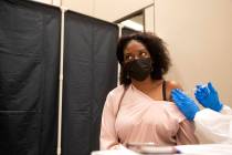 Jessica Dula receives the Pfizer COVID-19 vaccination during a COVID-19 vaccine clinic at Resor ...