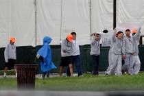 Migrant children walk on the grounds of the Homestead Temporary Shelter for Unaccompanied Child ...