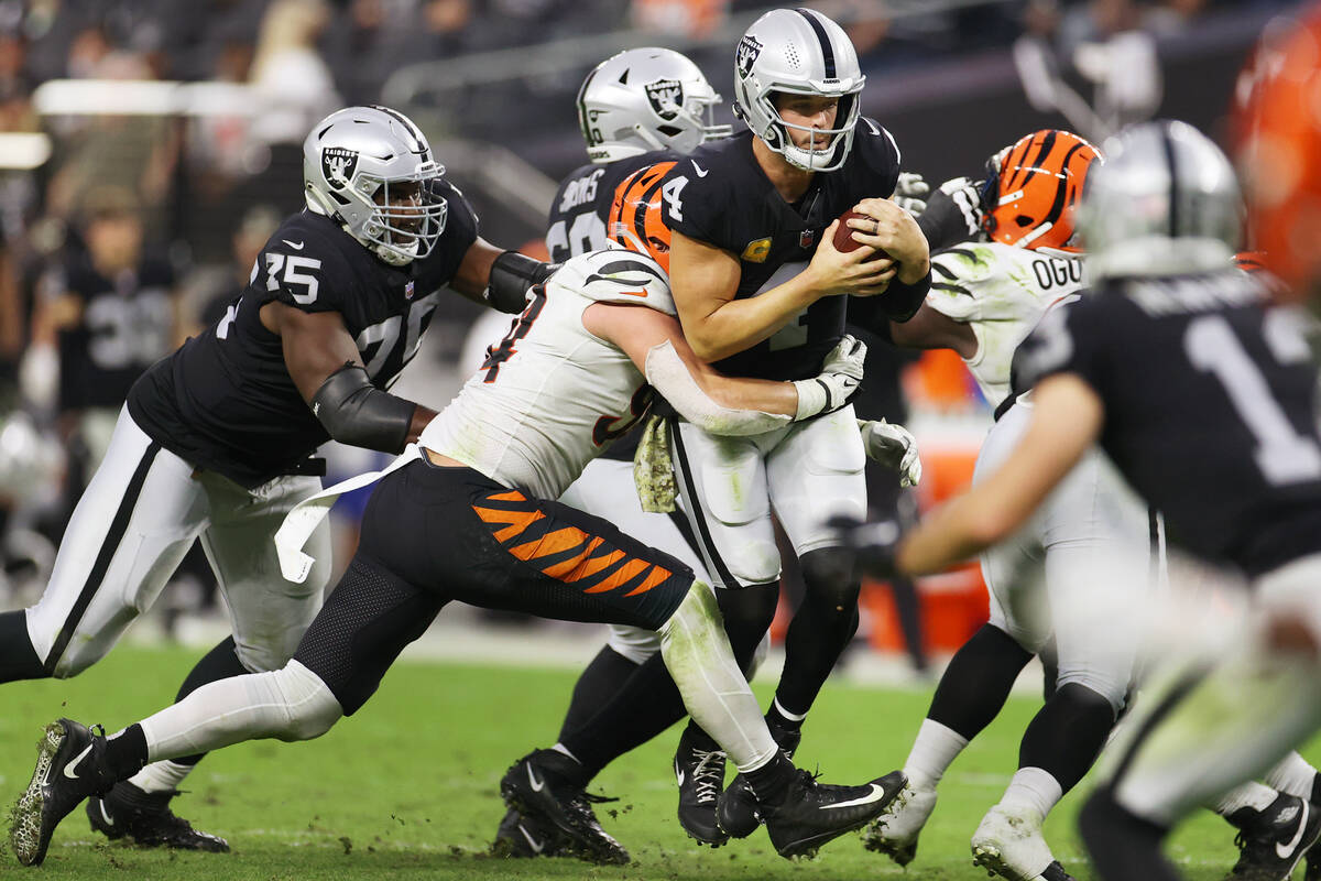 Cincinnati Bengals defensive end Sam Hubbard (94) sacks Raiders quarterback Derek Carr (4) duri ...