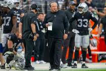 Raiders linebacker coach Richard Smith walks the sideline during the fourth quarter of an NFL f ...