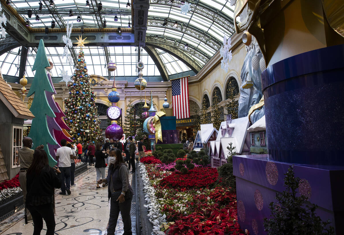Tourists visit The Bellagio Conservatory's holiday display "Holiday Time" on Tuesday, Nov. 23, ...