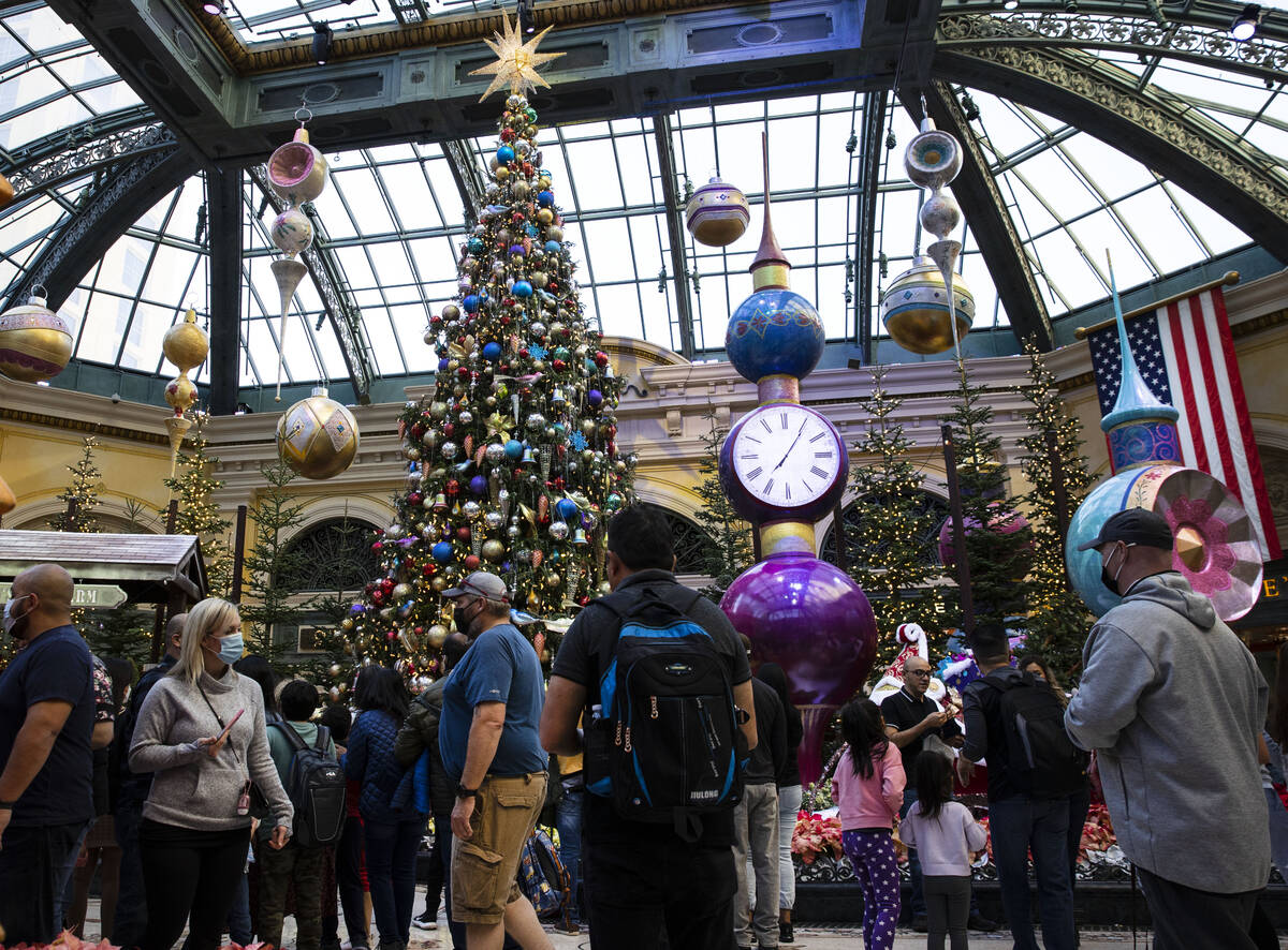 Tourists visit The Bellagio Conservatory's holiday display "Holiday Time" on Tuesday, Nov. 23, ...