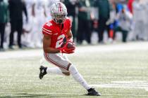 Ohio State receiver Chris Olave plays against Michigan State during an NCAA college football ga ...