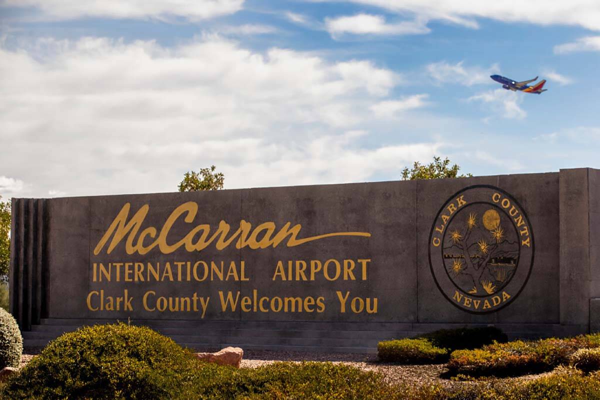 Sign for McCarran International Airport with level   taking disconnected  supra  astatine  Tropicana Avenue and Kov ...