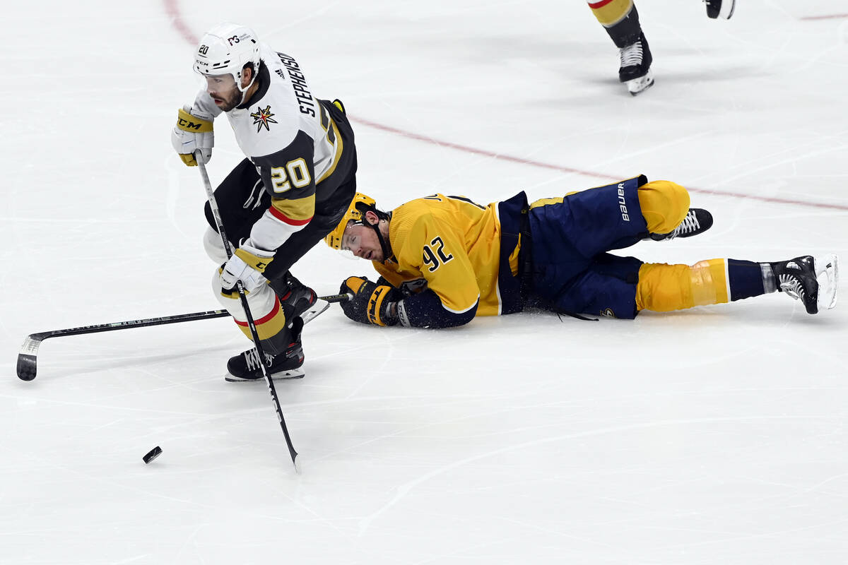 Vegas Golden Knights center Chandler Stephenson (20) takes the puck past Nashville Predators ce ...