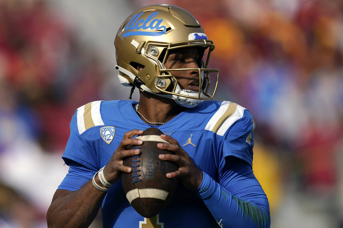 UCLA quarterback Dorian Thompson-Robinson gets set to pass during the first half of an NCAA col ...