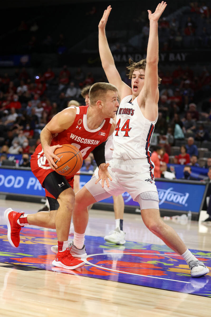 St. Mary's Gaels guard Alex Ducas (44) defends against Wisconsin Badgers guard Brad Davison (34 ...