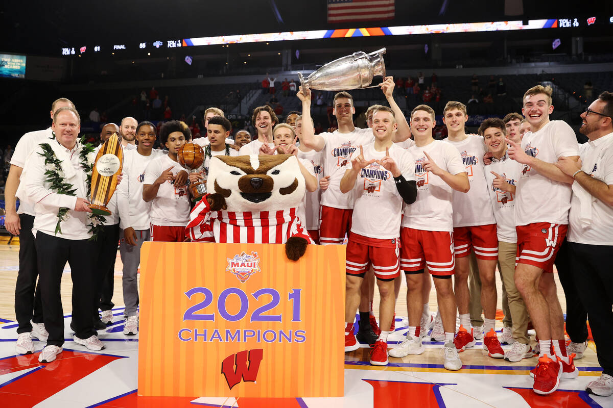 The Wisconsin Badgers celebrate their win against St. Mary's Gaels in the NCAA Maui Invitationa ...