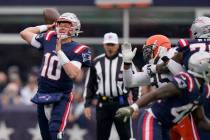 New England Patriots quarterback Mac Jones (10) throws a pass during the first half of an NFL f ...