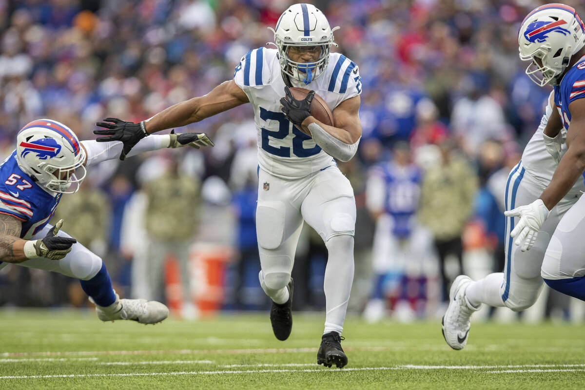 Running back (28) Jonathan Taylor of the Indianapolis Colts runs the ball against the Buffalo B ...