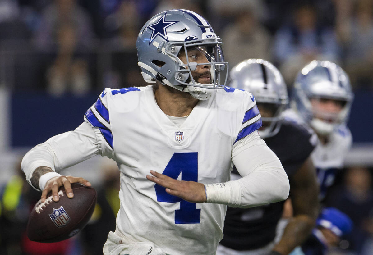 Dallas Cowboys quarterback Dak Prescott (4) scrambles in the second half during an NFL football ...