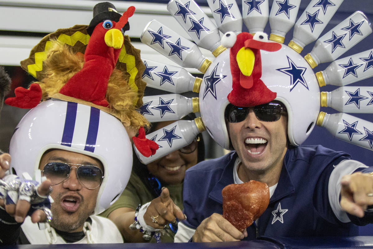 Dallas Cowboys fans cheer during the fourth quarter of an NFL football game against the Raiders ...