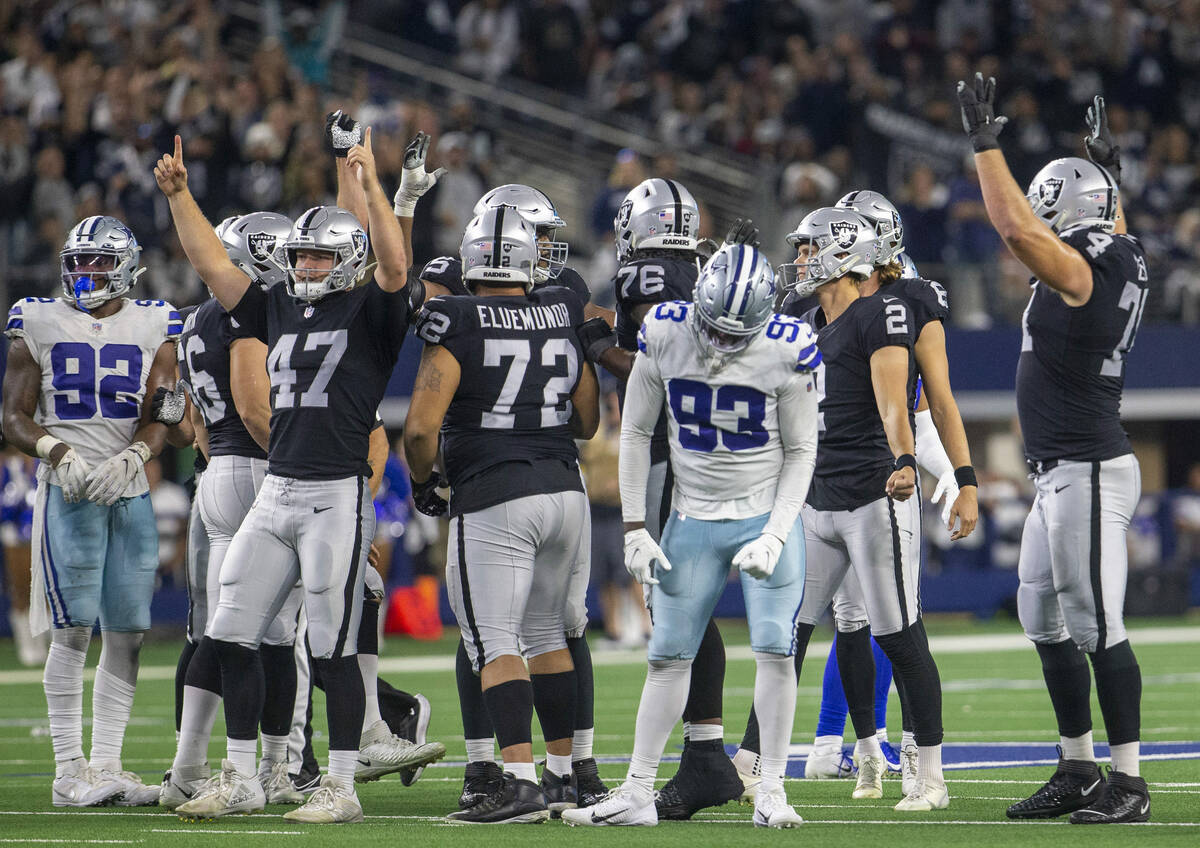 Raiders special teams unit celebrates after Raiders kicker Daniel Carlson (2) kicked a go-ahead ...