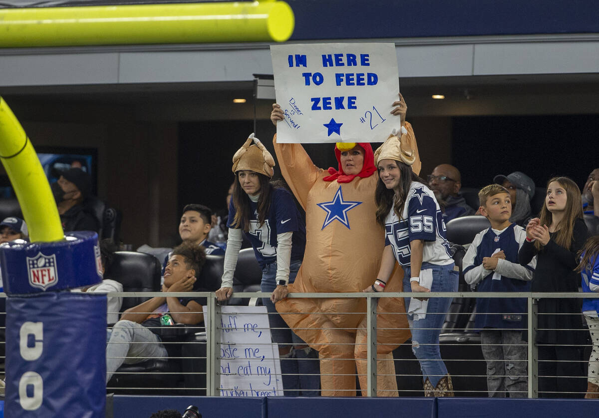 A Dallas Cowboys fan holds up a sign during the first quarter of an NFL football game against t ...